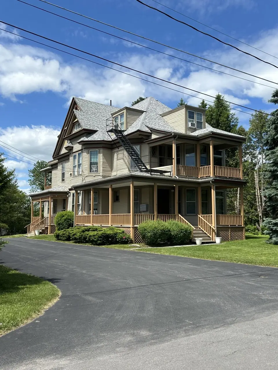 Restored Victorian mansion at 121 Park Drive, Manlius, with wraparound porch
