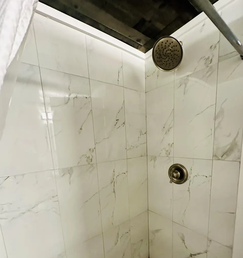 Marble-tiled walk-in shower